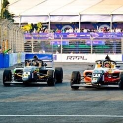 Raoul Hyman and Fabienne Wohlwend celebrate after winning Round 4 of the Indian Racing Festival on the Goa street circuit.