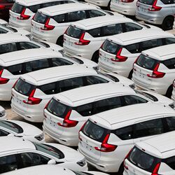 Vehicles at a dealership yard as automakers report strong sales growth in March and Q4 FY26.