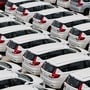 Vehicles at a dealership yard as automakers report strong sales growth in March and Q4 FY26.
