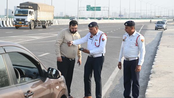 Delhi Traffic Police personnel conduct checks during a citywide special drive against parking violations and wrong-side driving.