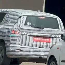The test mule was spotted with EV-specific alloy wheels. 
