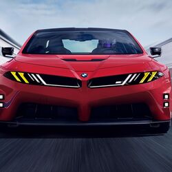 The styling is unmistakably BMW M. It sits low and wide, with chunky wheel arches and an aggressive stance, but the details are completely new.