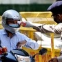 Security personnel screens the temperature of staff of Nirman Bhavan, as the ministers and staff re-join the offices in New Delhi on Monday. (ANI Photo/ Rahul Singh)