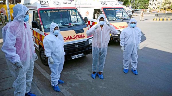 Health staff wear protective suits before taking out the patients positive with COVID 19 at Telierganj area in Prayagraj on Friday. (ANI Photo) Health staff wear protective suits before taking out the patients positive with COVID 19 at Telierganj area in Prayagraj on Friday. (ANI Photo)