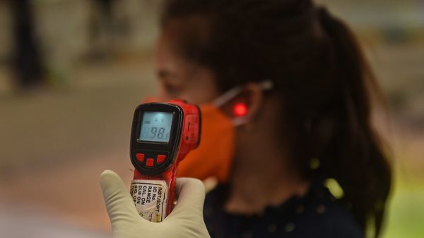 Kolkata: A medic conducts thermal screening of a passenger waiting to board a train to Delhi at Howrah station, during the ongoing COVID-19 nationwide lockdown, in Kolkata, Sunday, May 17, 2020. (PTI Photo/Ashok Bhaumik)(PTI17-05-2020_000093A) (PTI) Kolkata: A medic conducts thermal screening of a passenger waiting to board a train to Delhi at Howrah station, during the ongoing COVID-19 nationwide lockdown, in Kolkata, Sunday, May 17, 2020. (PTI Photo/Ashok Bhaumik)(PTI17-05-2020_000093A) (PTI)