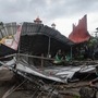 Kottayam: A man walks past a damaged structure following gusty winds ahead of the landfall of Cyclone Amphan, at Vaikom in Kottayam, Monday, May 18, 2020. (PTI Photo)(PTI18-05-2020_000312A) (PTI)