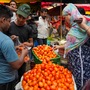এর আগে মে মাসে পাইকারি বাজারে মাত্র ৩ থেকে ৫ টাকা কেজি দরে বিকোচ্ছিল টমেটো। এই আবহে রাজের মাথায় বহু কৃষক নিজেদের ফলন রাস্তায় ফেলে তার ওপর দিয়ে ট্র্যাক্টর চালিয়ে দিয়েছিল। এদিকে হরিয়ানা, উত্তরপ্রদেশের বহু জায়গায় বৃষ্টির জেরে টমেটো সরবরাহ কমেছে সেই রাজ্যগুলি থেকেও।   (PTI)