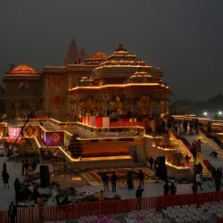 Workers decorate a temple dedicated to Hindu deity Lord Ram with flowers on the eve of the temple's grand opening in Ayodhya, India, Sunday, Jan. 21, 2024. (AP Photo/Rajesh Kumar Singh) (AP)