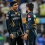 Gujarat Titans' Rashid Khan (R) speaks with captain Shubman Gill during the Indian Premier League (IPL) Twenty20 cricket match between Mumbai Indians and Gujarat Titans at the Wankhede Stadium in Mumbai on May 6, 2025. (Photo by INDRANIL MUKHERJEE / AFP) / -- IMAGE RESTRICTED TO EDITORIAL USE - STRICTLY NO COMMERCIAL USE -- (AFP)