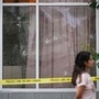 Bullet holes are seen in the windows of a cafe, in Surrey, British Columbia, Thursday, July 10, 2025, as Surrey Police investigate shots that were fired at Kap's Cafe, which is linked to comic and television host Kapil Sharma, who posted a video of the new establishment on Instagram this week. AP/PTI(AP07_11_2025_000006B)