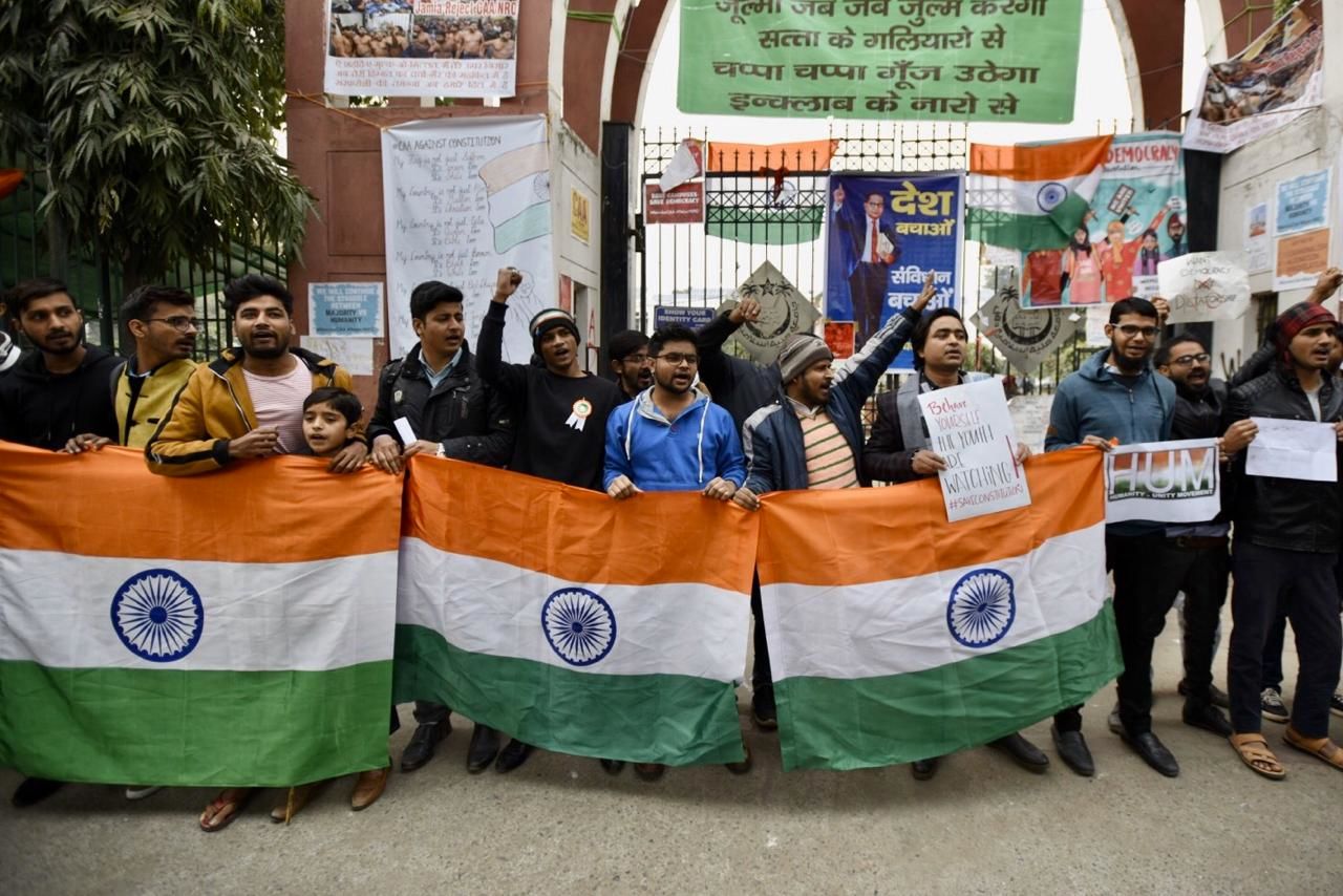 <p>Protesters gather outside Jamia in solidarity with JNU students</p>