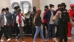 Relatives of passengers arrive at a crisis center set up following a report that a Sriwijaya Air passenger jet has lost contact with air traffic controllers shortly after take off, at Soekarno-Hatta International Airport in Tangerang, Indonesia,(AP) Relatives of passengers arrive at a crisis center set up following a report that a Sriwijaya Air passenger jet has lost contact with air traffic controllers shortly after take off, at Soekarno-Hatta International Airport in Tangerang, Indonesia,(AP)