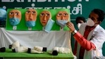 A health official adjusts a mask on a Covid-19 awareness exhibit during a dry run or a mock drill for the Covid-19 coronavirus vaccine delivery at a government hospital, in Chennai on January 8, 2021. (Photo by Arun SANKAR / AFP)(AFP) A health official adjusts a mask on a Covid-19 awareness exhibit during a dry run or a mock drill for the Covid-19 coronavirus vaccine delivery at a government hospital, in Chennai on January 8, 2021. (Photo by Arun SANKAR / AFP)(AFP)