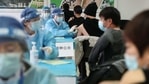 People receive vaccines against the Covid-19 coronavirus at a temporary vaccination centre in Beijing on January 8, 2021. (AFP) People receive vaccines against the Covid-19 coronavirus at a temporary vaccination centre in Beijing on January 8, 2021. (AFP)