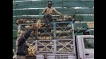 Workers load chickens in a van at Ghazipur mandi in New Delhi on Saturday. (PTI) Workers load chickens in a van at Ghazipur mandi in New Delhi on Saturday. (PTI)