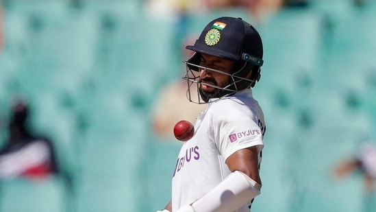 India's Cheteshwar Pujara reacts as he avoids a ball while batting during play on day three of the third cricket test between India and Australia at the Sydney Cricket Ground, Sydney, Australia, Saturday, Jan. 9, 2021.(AP)