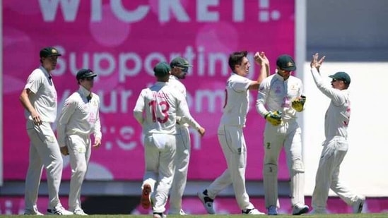 Australia players celebrate Pat Cummins' wicket of Cheteshwar Pujara of India during day three of the third test match between Australia and India at the SCG, Sydney, Australia, January 9, 2021. AAP Image/Dean Lewins via REUTERS(via REUTERS)