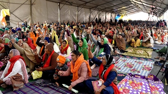 Farmers shout slogans during the ongoing protest against the new farm laws, at the Singhu border in New Delhi on Friday. (ANI Photo ) Farmers shout slogans during the ongoing protest against the new farm laws, at the Singhu border in New Delhi on Friday. (ANI Photo )