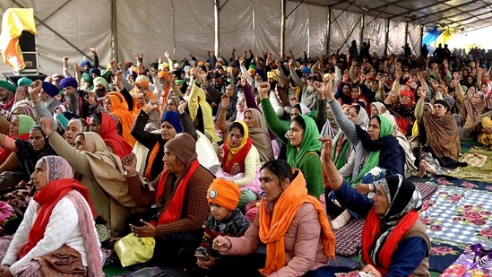 Farmers shout slogans during the ongoing protest against the new farm laws, at the Singhu border in New Delhi on Friday. (ANI Photo ) Farmers shout slogans during the ongoing protest against the new farm laws, at the Singhu border in New Delhi on Friday. (ANI Photo )