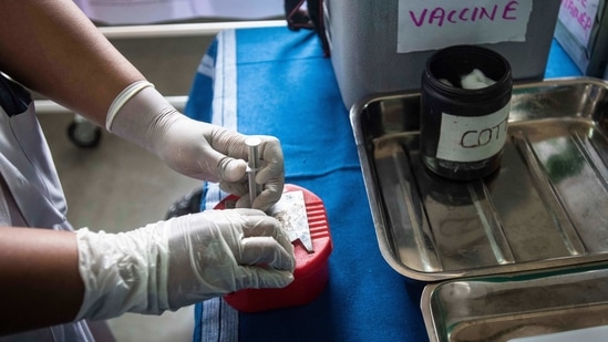 A health worker disposes a syringe during a dry run of Covid-19 vaccination at Rajiv Gandhi Hospital in Yerawada, Pune on January 8. The second mock drill on Covid-19 vaccination was conducted in 736 districts across 33 states and union territories.(Pratham Gokhale / HT Photo)