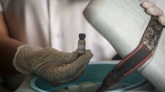 A health worker shows a dummy vial of Covid-19 vaccine during the dry run at Rajiv Gandhi Hospital in Yerawada, Pune on January 8. India’s drugs regulator has approved Oxford Covid-19 vaccine Covishield, being manufactured by the Serum Institute, and indigenously developed Covaxin of Bharat Biotech for restricted emergency use in India.(Pratham Gokhale / HT Photo)