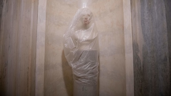 A blood-smeared bust of President Zachary Taylor covered with a plastic bag at the US Capitol on January 7. Joe Biden was formally ratified by the Congress as the next US president hours after the breach, ending two months of failed challenges by his predecessor, Donald Trump,(Graeme Sloan/Bloomberg)