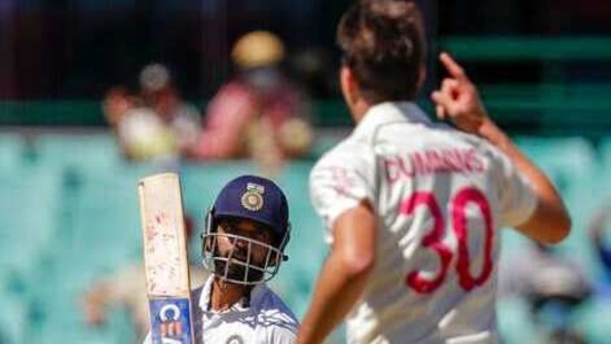 India's Ajinkya Rahane reacts after he was bowled by Australia's Pat Cummins, right, during play on day three of the third cricket test between India and Australia at the Sydney Cricket Ground, Sydney, Australia, Saturday, Jan. 9, 2021. (AP)