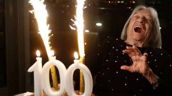 Agnes Keleti, former Olympic gold medal winning gymnast, reacts to fireworks going off on her birthday cake in Budapest.(AP) Agnes Keleti, former Olympic gold medal winning gymnast, reacts to fireworks going off on her birthday cake in Budapest.(AP)