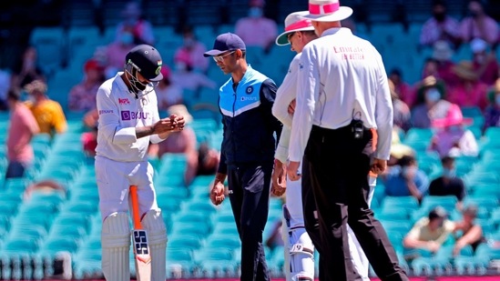 India's Ravindra Jadeja (L) holds his hand after he was hit by the ball on the third day of the third cricket Test match between Australia and India at the Sydney Cricket Ground (SCG) in Sydney on January 9, 2021. (AFP) India's Ravindra Jadeja (L) holds his hand after he was hit by the ball on the third day of the third cricket Test match between Australia and India at the Sydney Cricket Ground (SCG) in Sydney on January 9, 2021. (AFP)