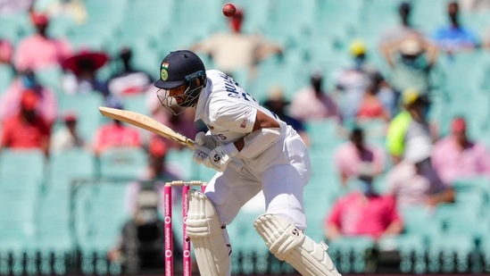India's Cheteshwar Pujara avoids a bouncer during play on day three of the third cricket test between India and Australia at the Sydney Cricket Ground, Sydney, Australia, Saturday, Jan. 9, 2021.(AP)