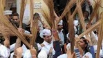Aam Aadmi Party supporters hold brooms, the party symbol.(Representational photo/AFP) Aam Aadmi Party supporters hold brooms, the party symbol.(Representational photo/AFP)