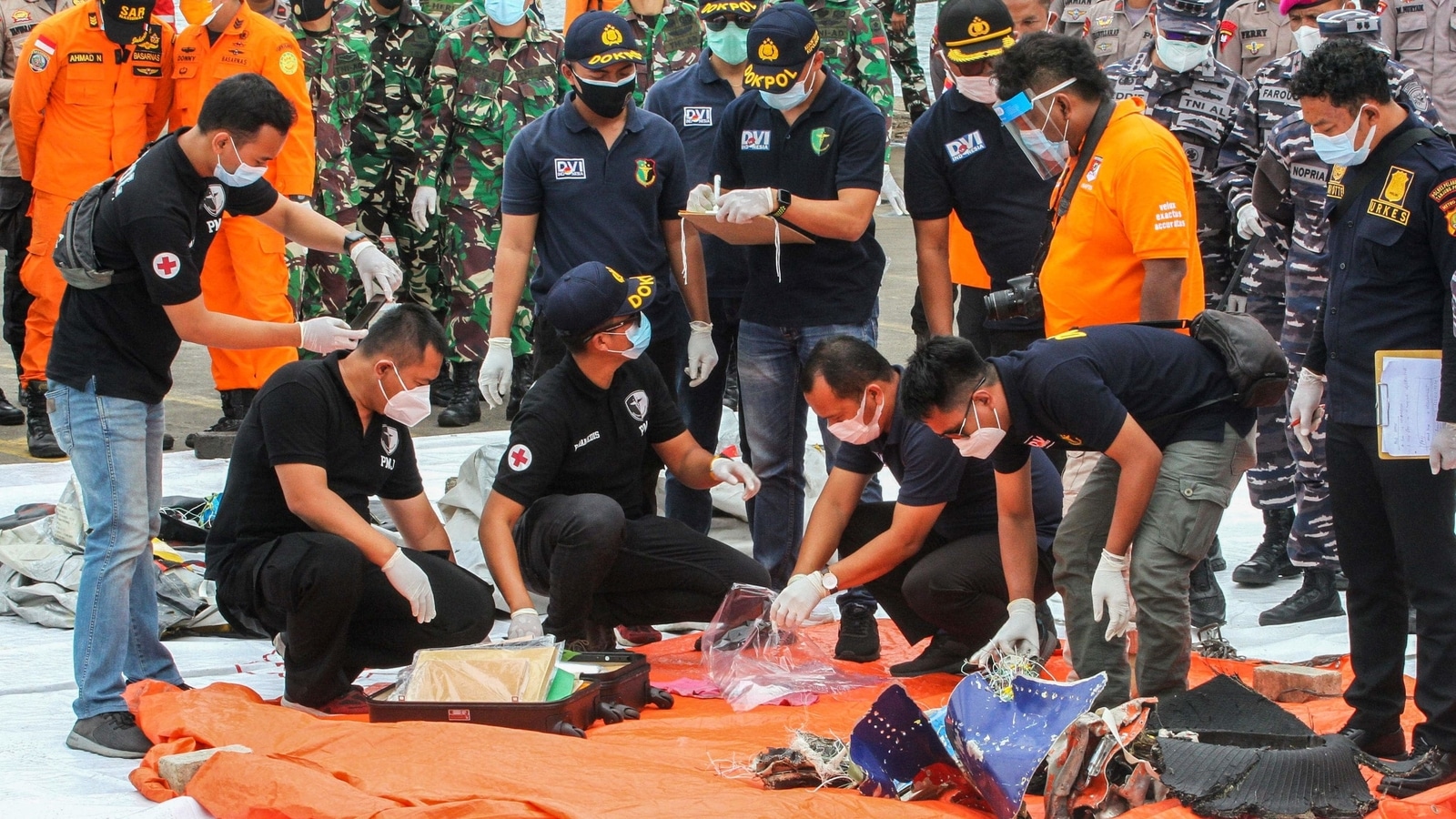 Photos: Indonesian search team locates debris of crashed jet