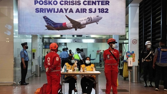 Medics and officials at the flight SJ 182 Crisis Centre at Soekarno-Hatta International Airport in Cengkareng, near Jakarta on January 9. The Boeing 737-500 with 12 crew members and 50 passengers on board was headed to Pontianak in West Kalimantan before it disappeared from radar screens four minutes after takeoff.(Dimas Ardian / Bloomberg)