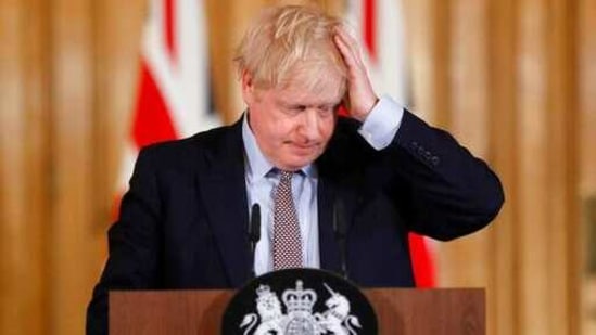 FILE - In this Tuesday, March 3, 2020 file photo Britain's Prime Minister Boris Johnson reacts during a press conference at Downing Street on the government's coronavirus action plan in London. Many countries are enduring new waves of the virus, but Britain's is among the worst, and it comes after a horrendous 2020. More than 3 million people in the U.K. have tested positive for the coronavirus and over 80,000 have died — 30,000 in just the last 30 days. The economy has shrunk by 8%, more than 800,000 jobs have been lost and hundreds of thousands more furloughed workers are in limbo. (AP Photo/Frank Augstein, File) (AP) FILE - In this Tuesday, March 3, 2020 file photo Britain's Prime Minister Boris Johnson reacts during a press conference at Downing Street on the government's coronavirus action plan in London. Many countries are enduring new waves of the virus, but Britain's is among the worst, and it comes after a horrendous 2020. More than 3 million people in the U.K. have tested positive for the coronavirus and over 80,000 have died — 30,000 in just the last 30 days. The economy has shrunk by 8%, more than 800,000 jobs have been lost and hundreds of thousands more furloughed workers are in limbo. (AP Photo/Frank Augstein, File) (AP)