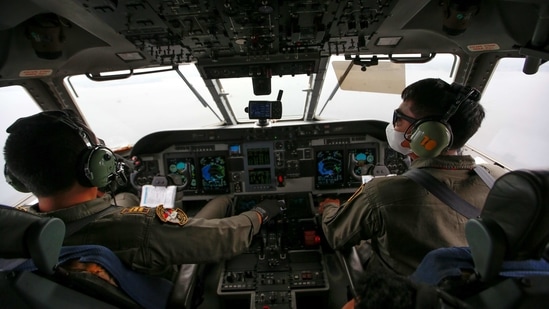 Indonesian Air Force pilots in the cockpit during an aerial search for the Sriwijaya Air SJ-182, in Jakarta on January 10. The search focuses on the outer ring of the Laki and Lancang islands off the Jakarta coast. The sea in this area is about 20 to 23 metres (65-75 feet) deep.(Willy Kurniawan / REUTERS)