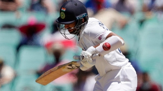 India's Cheteshwar Pujara is hit while batting during play on day three of the third cricket test between India and Australia at the Sydney Cricket Ground, Sydney, Australia, Saturday, Jan. 9, 2021. (AP) India's Cheteshwar Pujara is hit while batting during play on day three of the third cricket test between India and Australia at the Sydney Cricket Ground, Sydney, Australia, Saturday, Jan. 9, 2021. (AP)