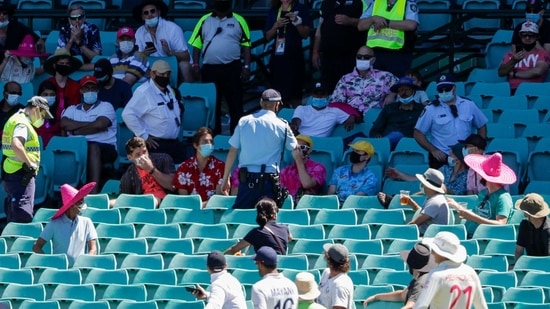 Sydney : Police talk to spectators as the game is stopped after a complaint by Indian players during play on day four of the third cricket test between India and Australia at the Sydney Cricket Ground, Sydney, Australia, Sunday, Jan. 10, 2021. (AP)