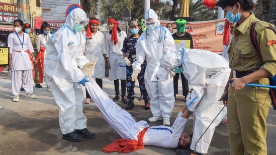 Students perform a street play to create awareness regarding Covid-19 in Gorakhpur. (PTI Photo) (PTI) Students perform a street play to create awareness regarding Covid-19 in Gorakhpur. (PTI Photo) (PTI)