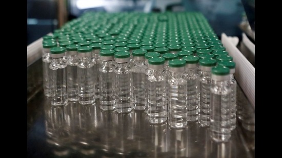 Vials of Oxford-AstraZeneca's Covishield vaccine are seen before they are packaged inside a lab at Serum Institute of India, in Pune. (REUTERS FILE) Vials of Oxford-AstraZeneca's Covishield vaccine are seen before they are packaged inside a lab at Serum Institute of India, in Pune. (REUTERS FILE)