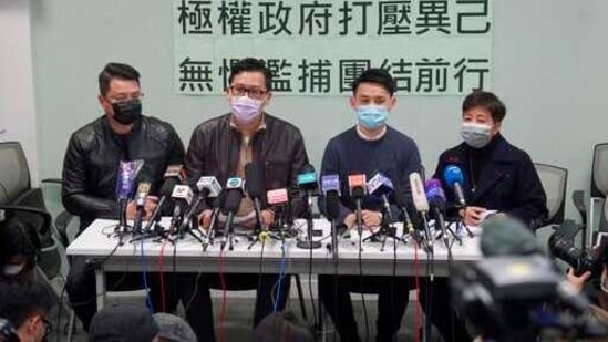 Former Democratic Party legislators Andrew Wan, left, Lam Cheuk-ting, second left, and Helena Wong, right, attend a press conference after being released on bail in Hong Kong. (AP Photo)(AP)