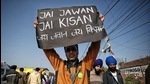 A farmer holds a placard during their ongoing protest against new farm laws, Singhu border, Delhi, January 10, 2020 (ANI) A farmer holds a placard during their ongoing protest against new farm laws, Singhu border, Delhi, January 10, 2020 (ANI)