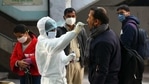 Health worker in PPE collects a swab sample from a person for coronavirus testing, outside New Ashok Nagar Metro station in New Delhi, Health worker in PPE collects a swab sample from a person for coronavirus testing, outside New Ashok Nagar Metro station in New Delhi,
