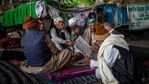 A group of farmers share a hookah as they chat while blocking a major highway in protest against new farm laws at the Delhi-Uttar Pradesh state border, India, Monday, Jan. 11, 2021. (AP Photo/Altaf Qadri)(AP) A group of farmers share a hookah as they chat while blocking a major highway in protest against new farm laws at the Delhi-Uttar Pradesh state border, India, Monday, Jan. 11, 2021. (AP Photo/Altaf Qadri)(AP)