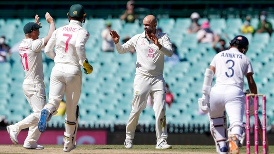 Australia's Nathan Lyon, second right, is congratulated by teammates after dismissing India's Ajinkya Rahane, right, during play on the final day of the third cricket test between India and Australia at the Sydney Cricket Ground, Sydney, Australia, Monday, Jan. 11, 2021.(AP)