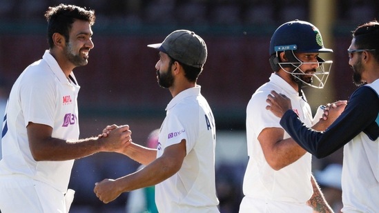 India's Ravichandran Ashwin, left, is congratulated by his captain Ajinkya Rahane as Hanuma Vihari is congratulated by teammate Mohammed Siraj, right, following play on the final day of the third cricket test between India and Australia at the Sydney Cricket Ground, Sydney, Australia, Monday, Jan. 11, 2021. The test ended in a draw and the series is at 1-1 all with one test to play. (AP Photo/Rick Rycroft)(AP)