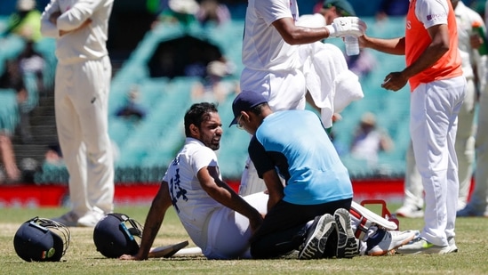 India's Hanuma Vihari receives treatment to a leg injury during play on the final day of the third cricket test between India and Australia at the Sydney Cricket Ground.(AP) India's Hanuma Vihari receives treatment to a leg injury during play on the final day of the third cricket test between India and Australia at the Sydney Cricket Ground.(AP)