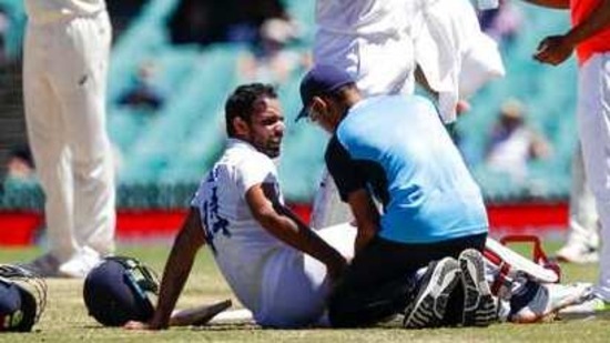 India's Hanuma Vihari receives treatment to a leg injury during play on the final day of the third cricket test between India and Australia at the Sydney Cricket Ground, Sydney, Australia, Monday, Jan. 11, 2021. (AP Photo/Rick Rycroft)(AP)