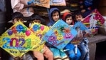 Prayagraj: Children pose with kites at a shop in a market, ahead of the Makar Sankranti and Lohri festivals, in Prayagraj, Monday, Jan. 11, 2021.(PTI) Prayagraj: Children pose with kites at a shop in a market, ahead of the Makar Sankranti and Lohri festivals, in Prayagraj, Monday, Jan. 11, 2021.(PTI)