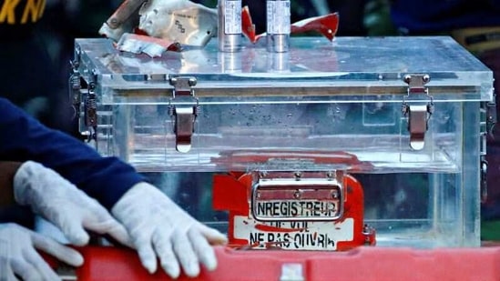 A National Transportation Safety Committee (KNKT) official holds a part of the retrieved black box of Sriwijaya Air flight SJ 182.(REUTERS)