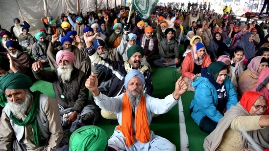 Farmers shout slogans during an ongoing protest against the new farm laws, at the Singhu border in New Delhi on Tuesday.(ANI Photo ) Farmers shout slogans during an ongoing protest against the new farm laws, at the Singhu border in New Delhi on Tuesday.(ANI Photo )